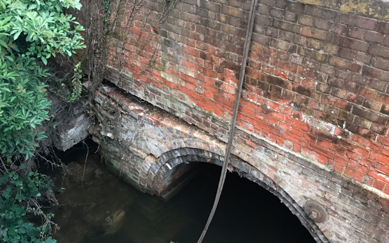 Damage to the northern arch of Bishopsford Road Bridge, caused as a result of flooding