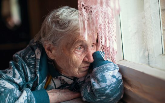 An elderly lady at home alone during the Coronavirus isolation measures