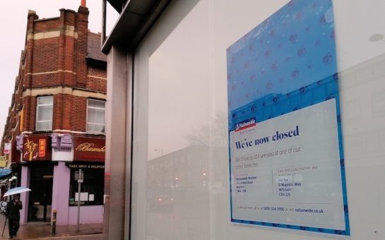 A poster in the window of the old Nationwide building in Mitcham announces the closure