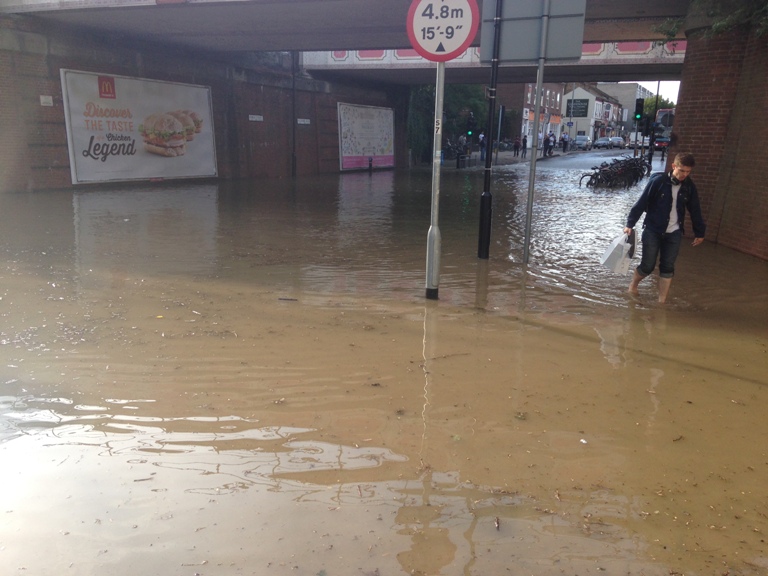 New Malden flood man paddling