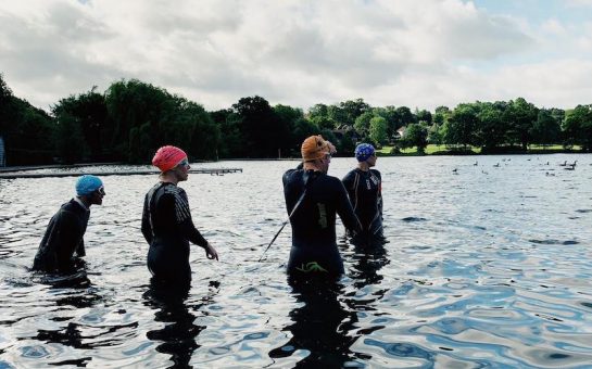 Wetsuit-clad swimmers test the water in Wimbledon Park