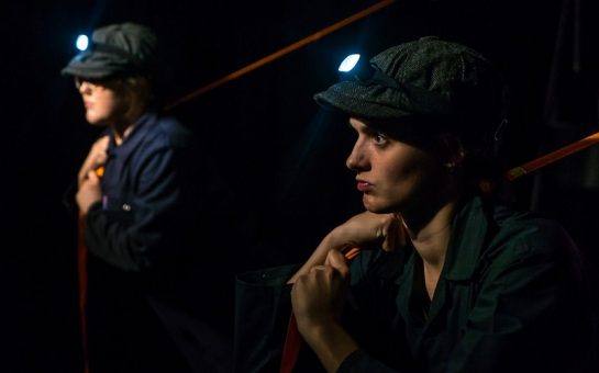 TALK PROPA actors on stage in flat caps