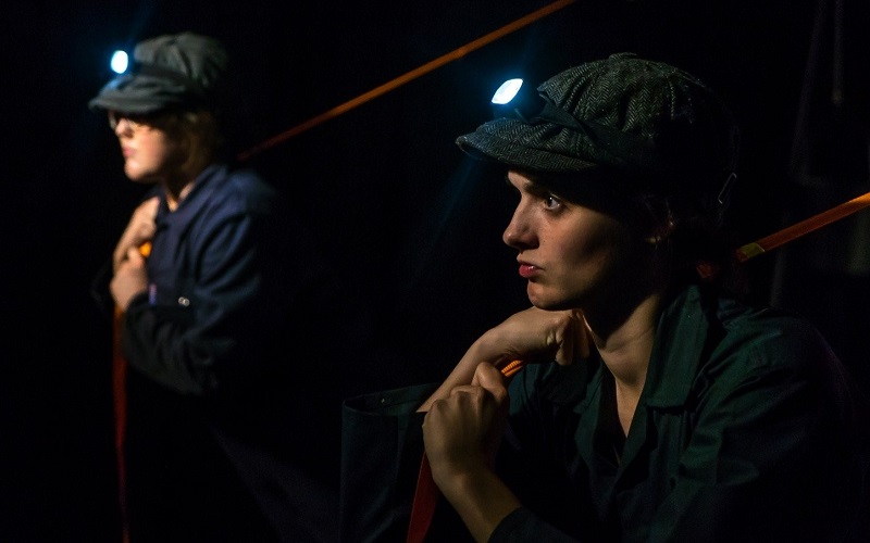 TALK PROPA actors on stage in flat caps