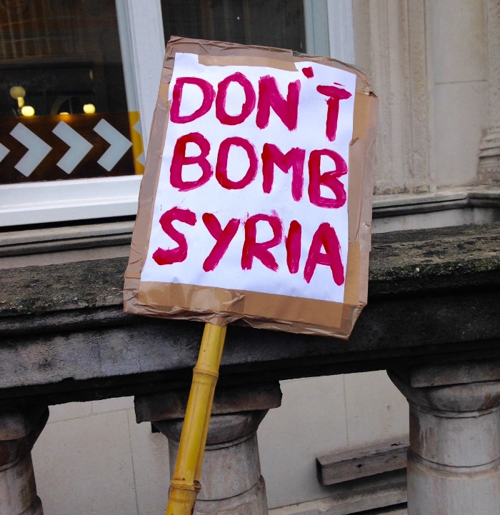 don't bomb syria placard