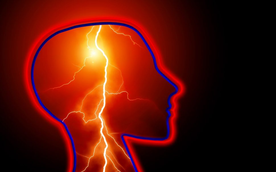 Profile of human head with lightening bolts inside