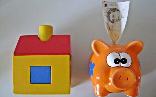 A toy house and a piggy bank