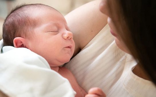 New born baby in mother's arms