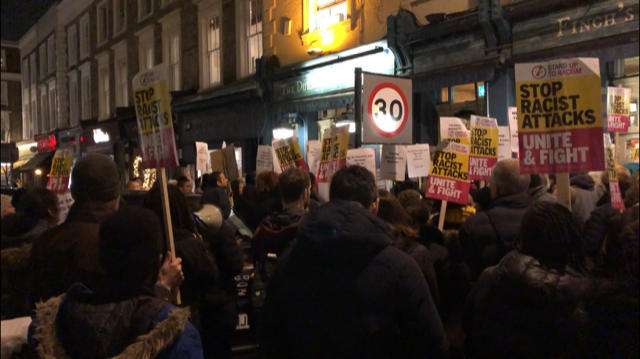 Protesters gather outside the Duke of Wellington Pub