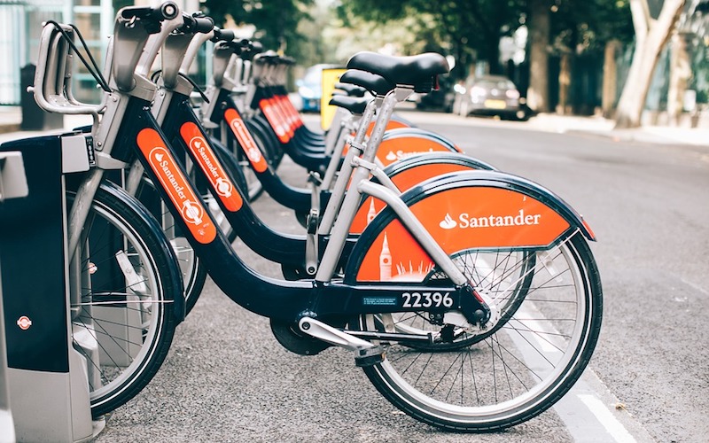 Orange and black Santander hire bikes parked in London