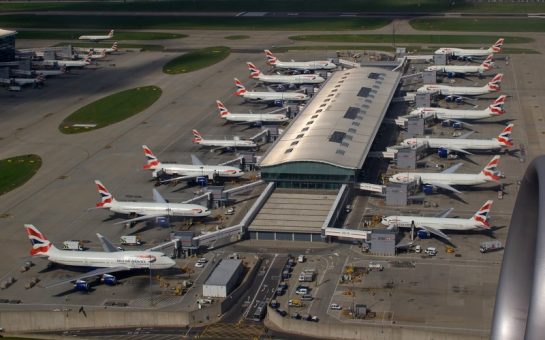 15 planes facing each other in two lines at an airport