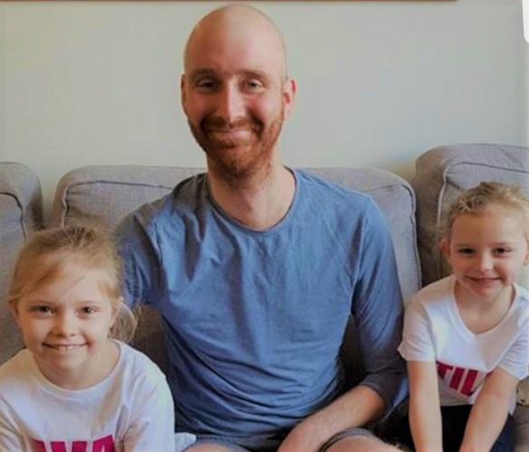 Bradley with Ava (left) and her younger sister Tilly (right) before the mini-marathon. 