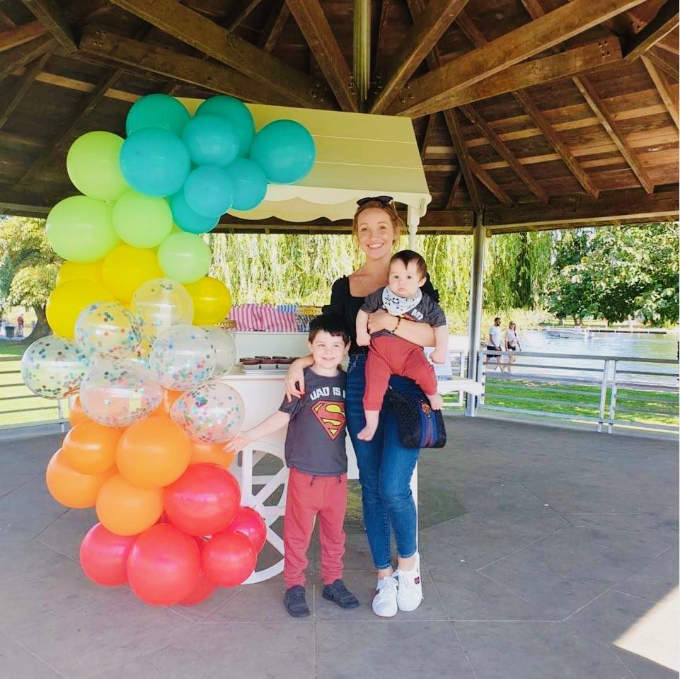 Marianne, Tom, and Teo wait for their father Anthony to finish the charity walk