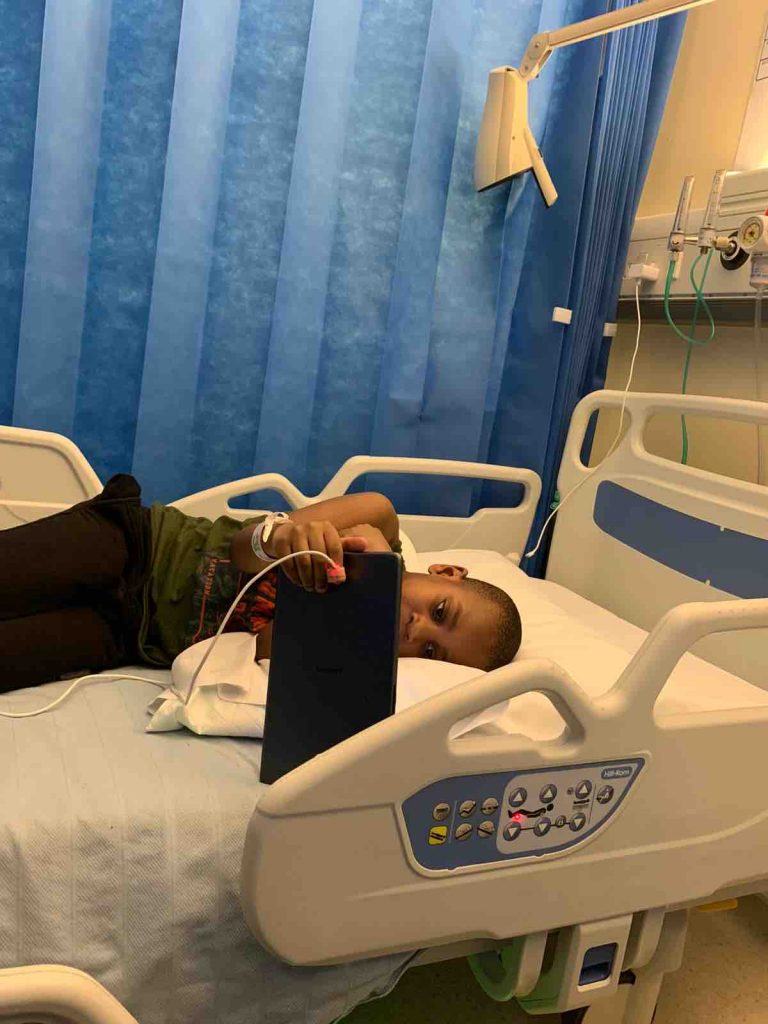 Jesse, a Croydon 6-year-old with cancer, lies on a hospital bed. From his GoFundMe page, permission to use from his family. 