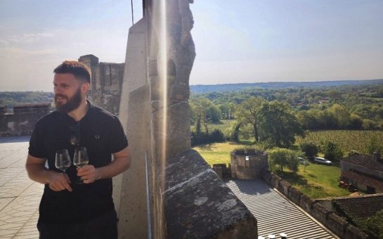 Jon Clements tasting wine at a winery