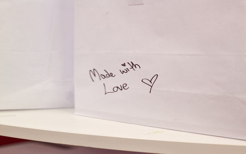 Cook to Care delivery bags handwritten 'Made with Love'