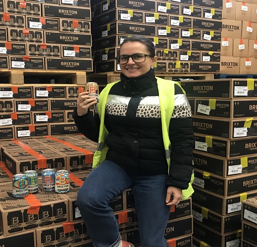 Co-founder Xochitl Benjamin with award-winning cans at Brixton Brewery