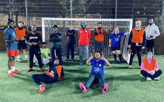 Minds United team in front of goal