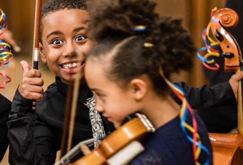 children playing music