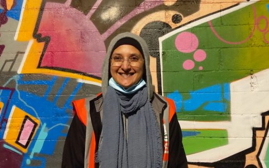 The co-found of Tooting Community Kitchen smiles at the camera
