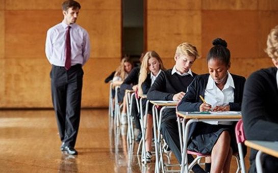 teacher with pupils sitting exams