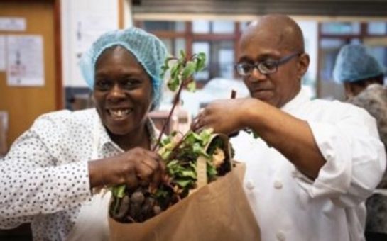 two share community workers packing food