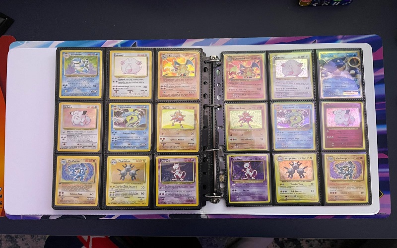 POKEMON cards in an open binder in pages of nine at a time