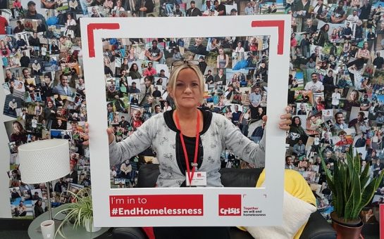 sutton homelessness support worker and MBE with a frame surrounded by pictures