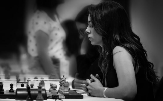 Dina Belenkaya playing chess black and white
