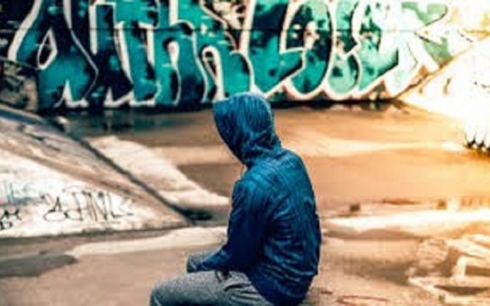 child sat alone in a skate park