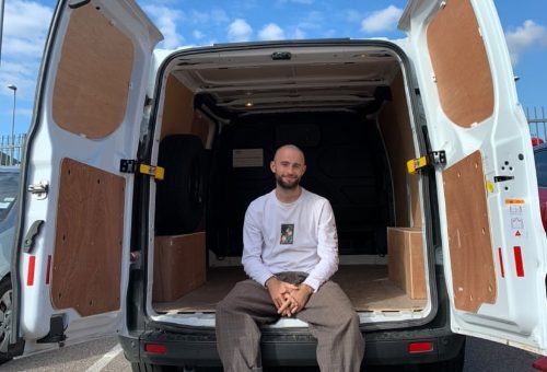 Founder of Pot Gang Sam Smith sits in van