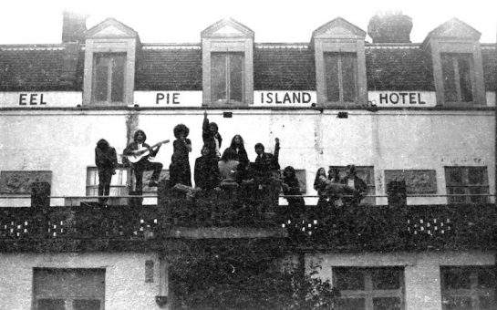 Eel Pie Island Hotel in 1969 members of the commune sit on the hotel's balcony. Photo Credit: Mark Pickthall