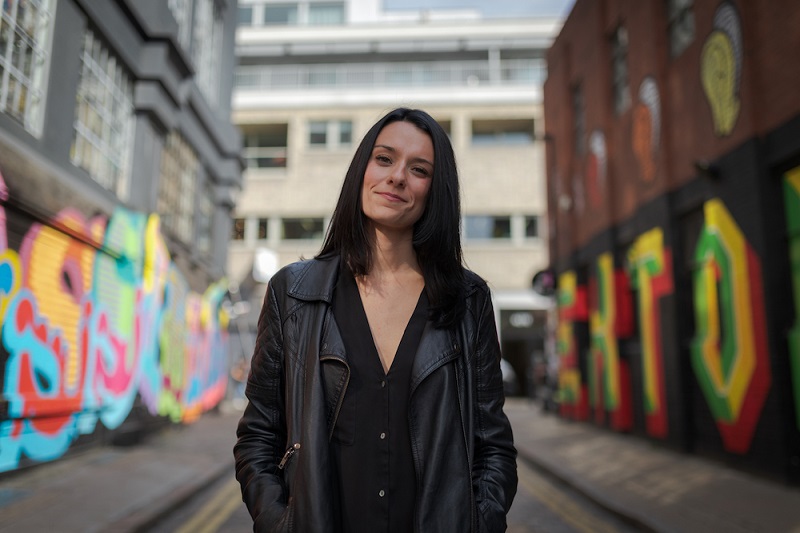 Love and London founder Jessica Dante stands facing the camera in a side street. Credit Jessica Dante