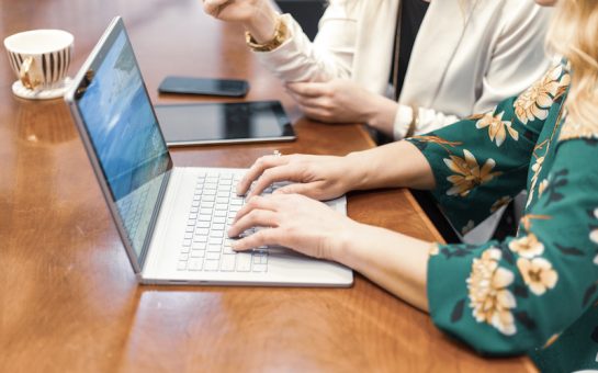 woman typing on computer