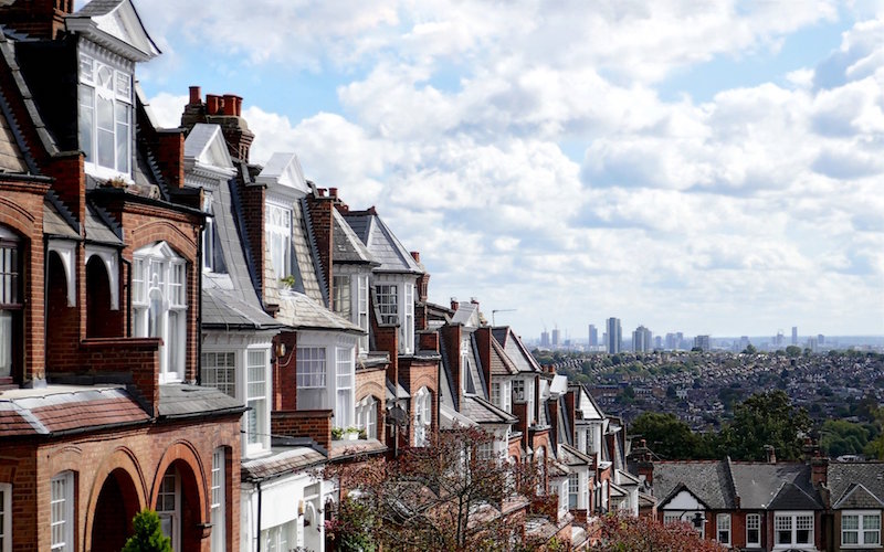 An image showing the London skyline from a suburb view