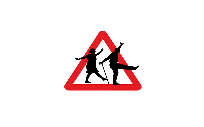 Read triangle road sign, with two elderly people dancing across the sign. The man has a walking stick