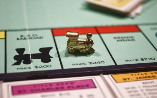 Train playable token on a classic Monopoly board