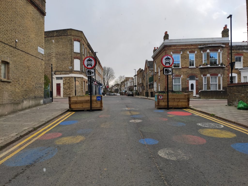 Two planters narrow the entrance to the Railton LTN in Brixton, London. The LTN has been controversial among residents, some of whom are leading a court case against Lambeth Council.