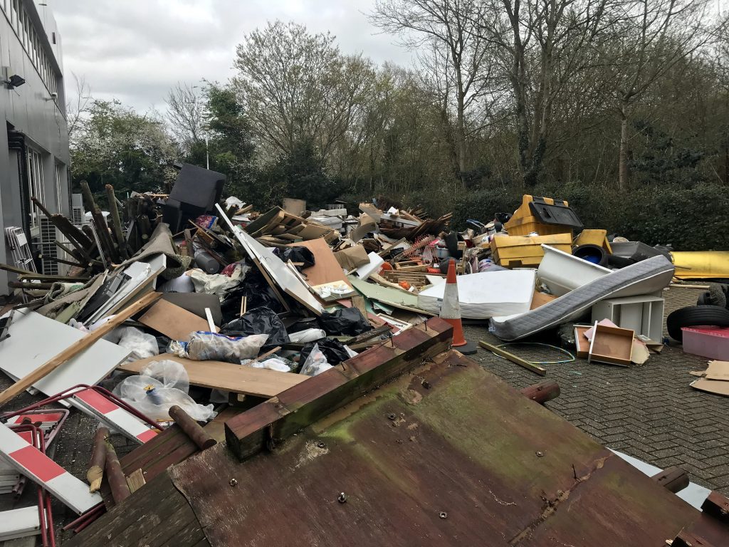 Mattresses, sofas, building waste and a gritting container dumped in car park of Tolworth businesses.