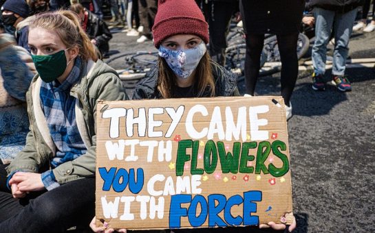 woman holding placard at protest