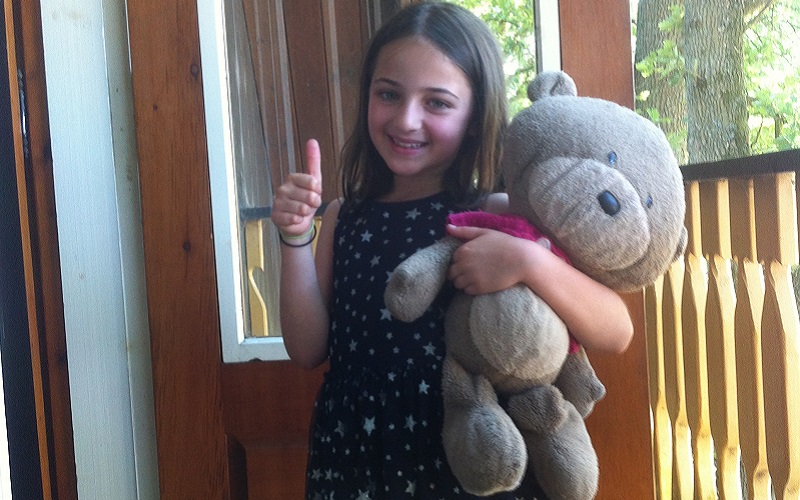 Mia Piesse with her bear ted, which inspired her book