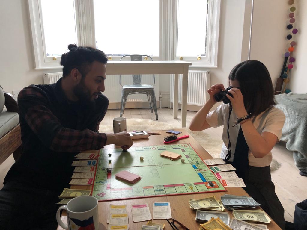 Picture of Yusuf playing monopoly 