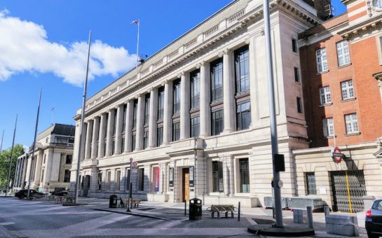 a photograph of the science museum front with blue skies behind.