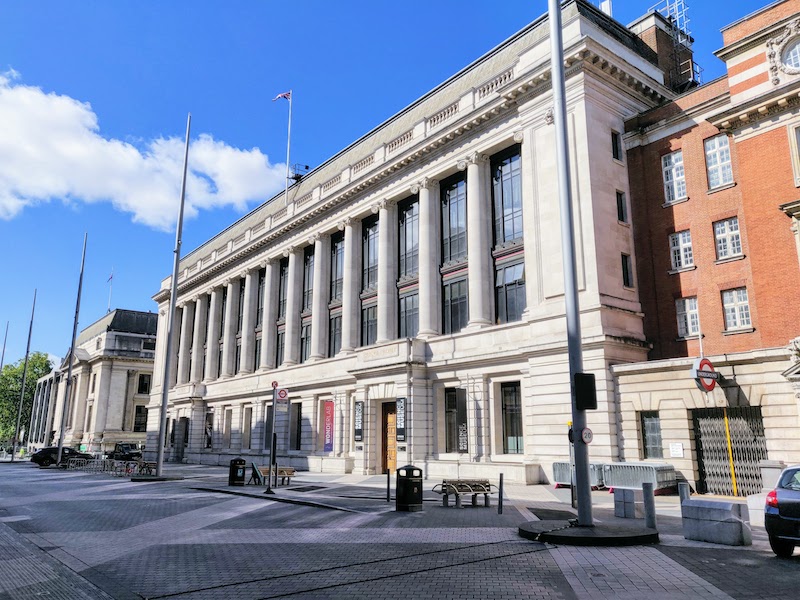 a photograph of the science museum front with blue skies behind.