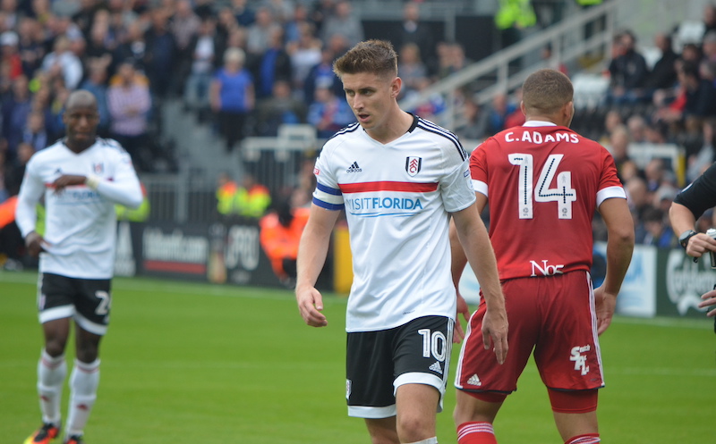 Tom Cairney on the football pitch in Fulham kit. 