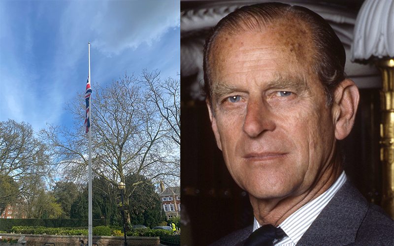 A Union flag at half mast in Richmond next to an image of the late Duke of Edinburgh to illustrate London MPs paying their respects