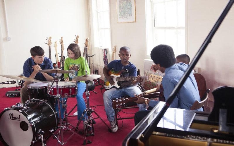 World Heart Beat music academy students playing instruments together. Photographer: Phil Conrad
