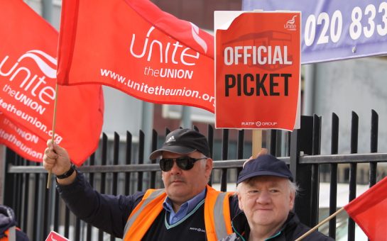 bus drivers carrying signs as part of their strike