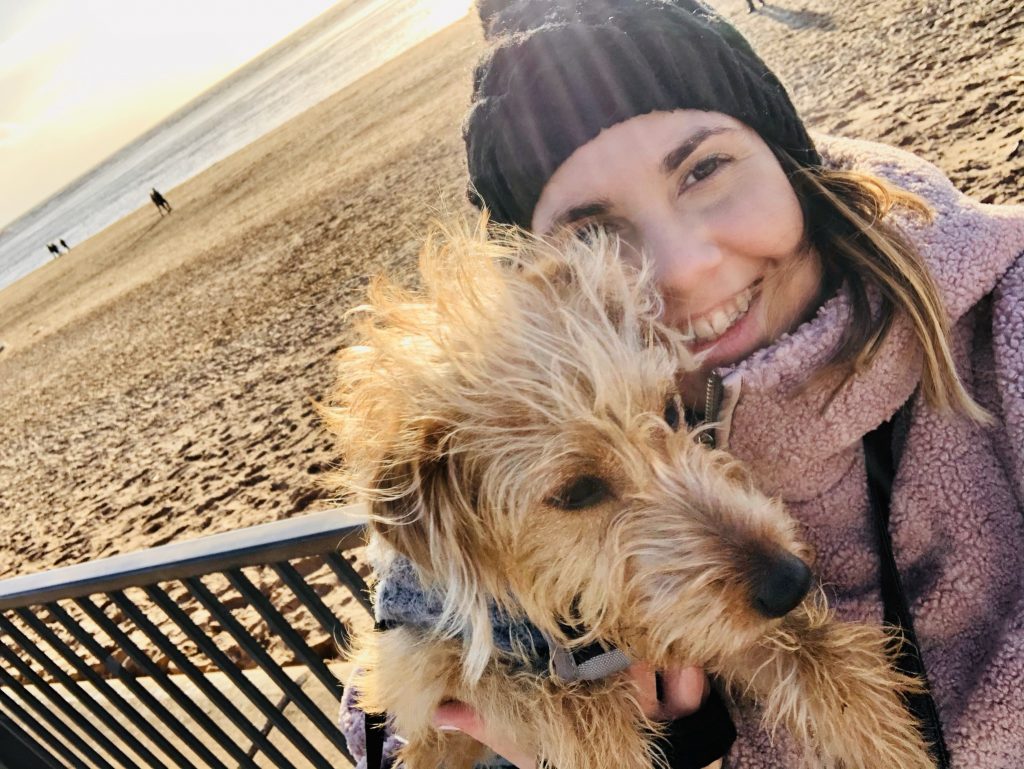 Miss Bunclark wants safe spaces for small dogs including her new jackapoo Maya, pictured with her at the beach.