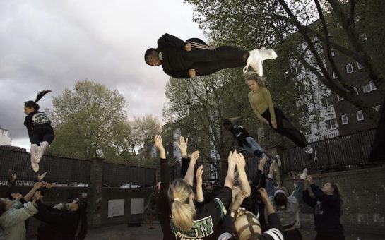 cheerleaders stunt, being thrown high in air