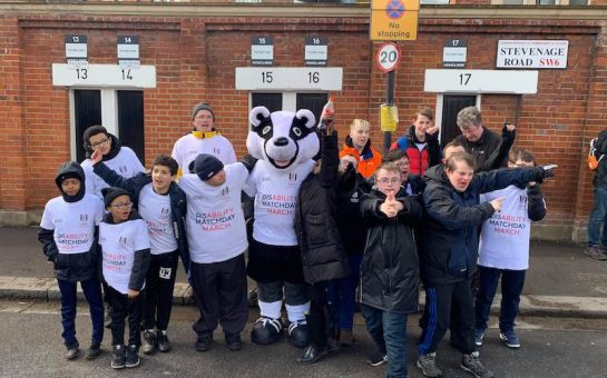 image of the matchday march 2020. Feature participants outside Craven Cottage and FFC mascot Billy the Badger